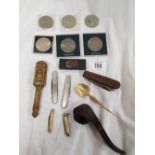 6 COMMEMORATIVE COINSNS, POCKET KNIVES, BRASS SET OF NUT CRACKERS, A SPOON AND BRIAR BARK PIPE BY