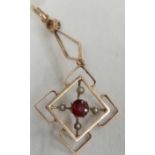 ATTRACTIVE GARNET & PEARL PENDANT SET IN 9 CT GOLD