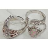 4 SILVER STONE SET RINGS