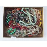 A large quantity of vintage glass bead necklaces & other necklaces