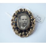 A Victorian mourning brooch with black enamel " in memory of"