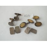 Three pairs of silver cufflinks