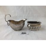 A boat shaped cream jug - Birmingham 1898 - and a half fluted salt - Chester 1899