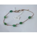 A fancy chain with chrysoprase beads in 9ct