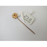 A garnet stick pin in 9ct