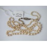 A pearl necklace with diamond set clasp