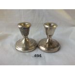 A pair of piano candlesticks on spreading bases - 2.5" high - Birmingham 1954
