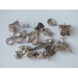 A bag of 17 assorted silver charms