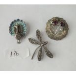 Three silver brooches including dragon fly & Scottish thistle brooch