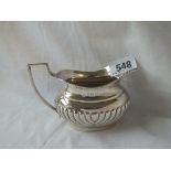 An oval half fluted cream jug - Birmingham 1921, 98 gms.