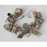 A silver charm bracelet - 67gms