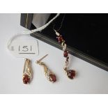 A garnet & diamond pendant with matching earrings in 9ct