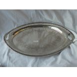 An attractive oval tea tray engraved with scroll work. Recessed handles - 20" wide - Sheffield