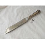 A silver handled bread knife with Sheffield steel blade