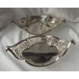 An attractive pair of boat shaped baskets with pierced sides - 13" long - one is London 1899 and the