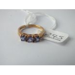 A 3 stone tanzanite ring in 9ct - size N - 2.7gms