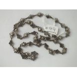 A fancy silver neck chain