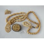 Two carved bone necklaces & 3 carved bone brooches