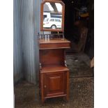 A Victorian walnut shaving stand with adjustable mirror