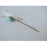 A turquoise drop stick pin in 15ct gold