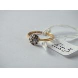 A diamond cluster ring set in 18ct gold (1 stone missing) - size L - 1.5gms