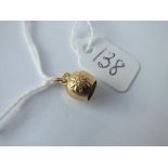 A Swiss cow bell charm with flower decoration in 14ct gold - 1.2gms