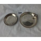 Two circular dishes, one with a cigarette holder - 57 gms.