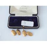 A cased set of engraved oval cufflinks in 9ct