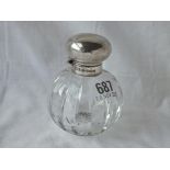 A circular salts bottle with stopper and glass body. Import mark.