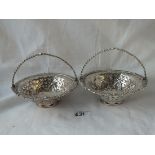 A pair of Georgian baskets with pierced bodies and swing handles - 5.5"DIA - by WH?