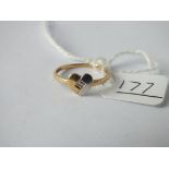 A diamond set heart ring in 18ct gold (tested) - size M - 1.3gms