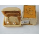 A pair of Ciro pearl earrings in bakelite original box & outer box