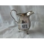 A Georgian style cream jug on three pad feet - B'ham 1915 - 55gms