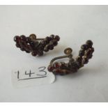 A pair of garnet screw back earrings
