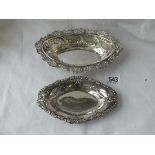 Two oval dishes with decorated borders - 7" and 6" long - one Birmingham 1904, both 122 gms.