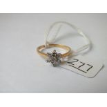 A diamond cluster ring set in 18ct gold - size O - 2.2gms
