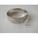 A wide silver bangle