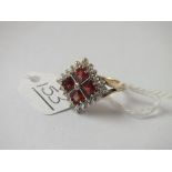 A red & white stoned dress ring in 9ct - size N - 4.5gms