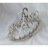 A good Victorian oval toast rack with seven bars - 7" long - B'ham 1880 by FE - 245gms