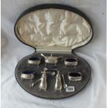 A good seven piece cruet set on pad feet, five BGL's, four cruet spoons - Birmingham 1921, 240