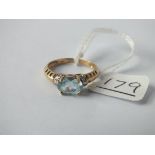 A blue topaz & diamond ring in 9ct - size M - 2.2gms
