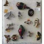 A pad of animal related costume brooches (14)