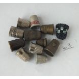 A bag containing 10 assorted thimbles including 2 silver ones