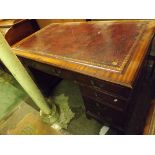 A Georgian style twin pedestal desk inset leather top