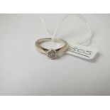 A white gold single stone diamond ring in 9ct - size k