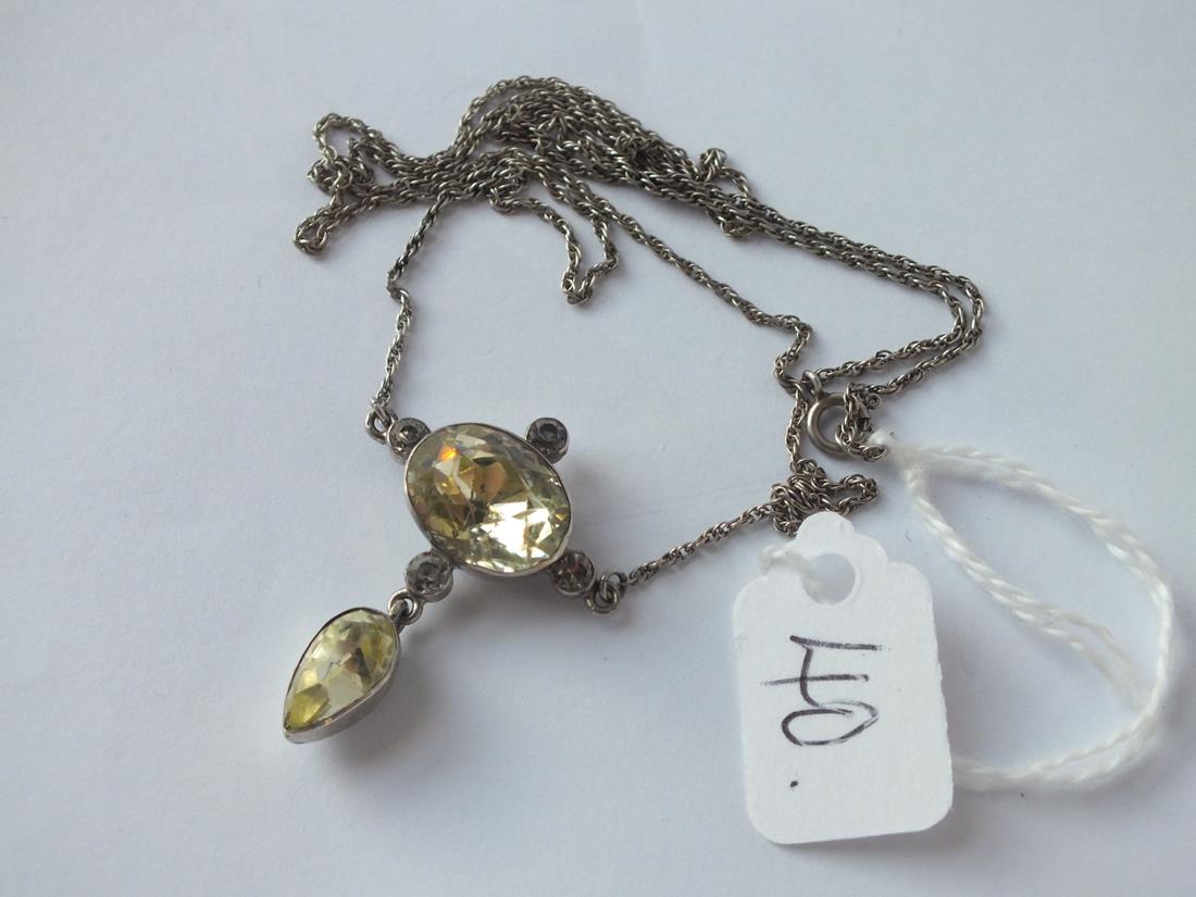 An antique paste drop pendant, silver mounted & on a silver chain