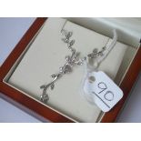 A diamond floral leaf necklace in 9ct
