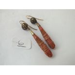 A pair of antique carved coral drop earrings