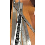QTY OF STAINLESS STEEL MEASURING RULES INCL; 1 BY 2 MTRS LONG