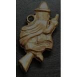 A 9ct GOLD CHARM OF A WITCH ON BROOM STICK